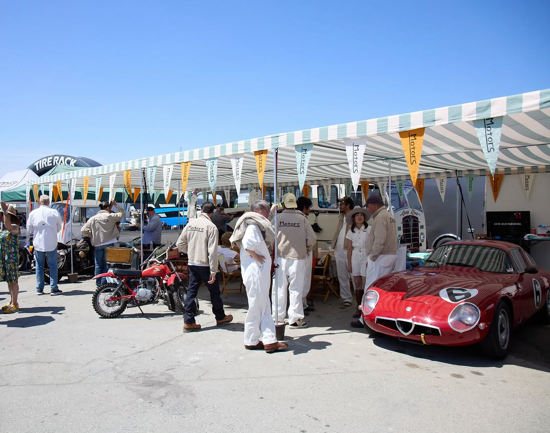 A lineup of classic cars at Monterey Car Week 2026 pits